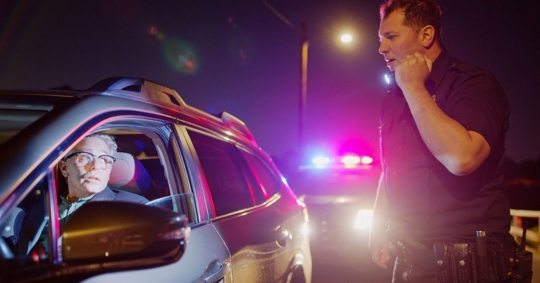 police officer checking the driver
